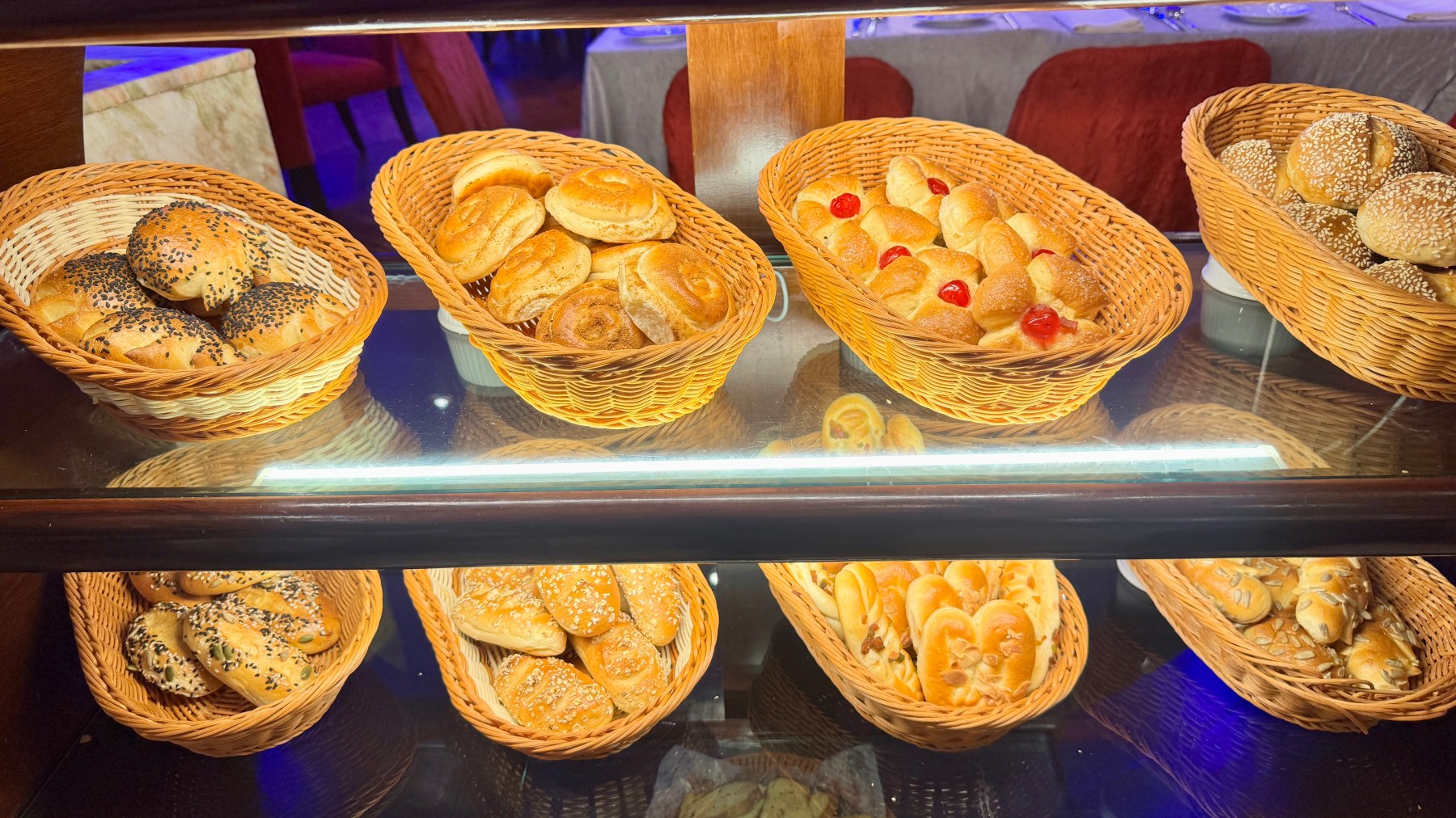 Baskets of bread rolls on shelves